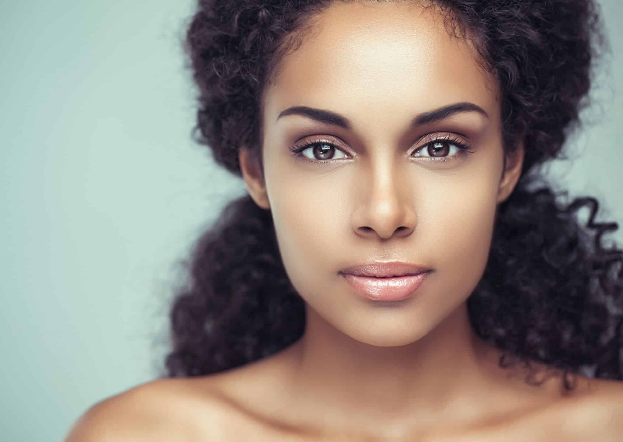 close-up portrait image of a young woman after getting rhinoplasty