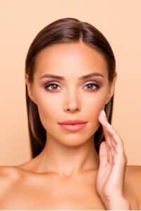 Young female model with brown hair and smooth skin